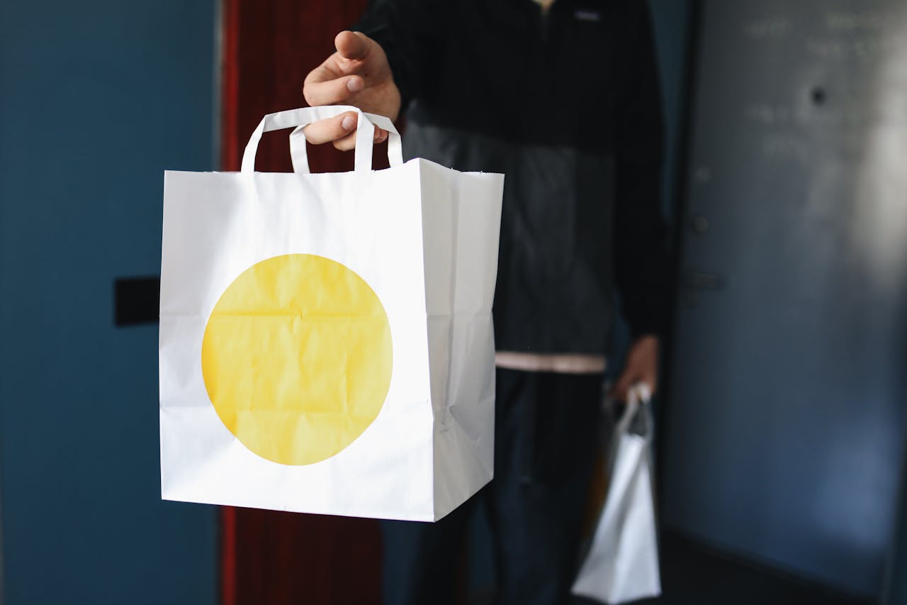 A Person Holding a Paper Bag